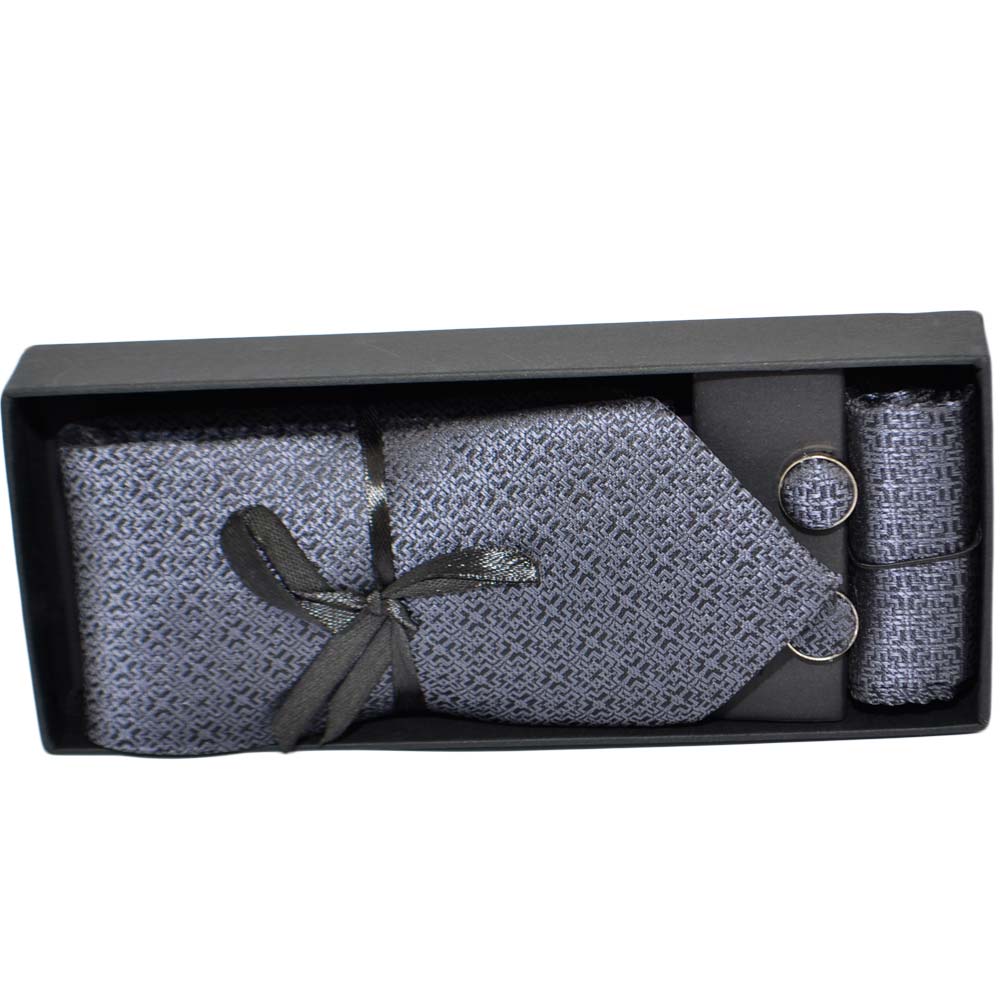 Set cravatta pochette e gemelli in cotone grigio con dettagli neri confezione regalo per professionisti e collezionisti.
