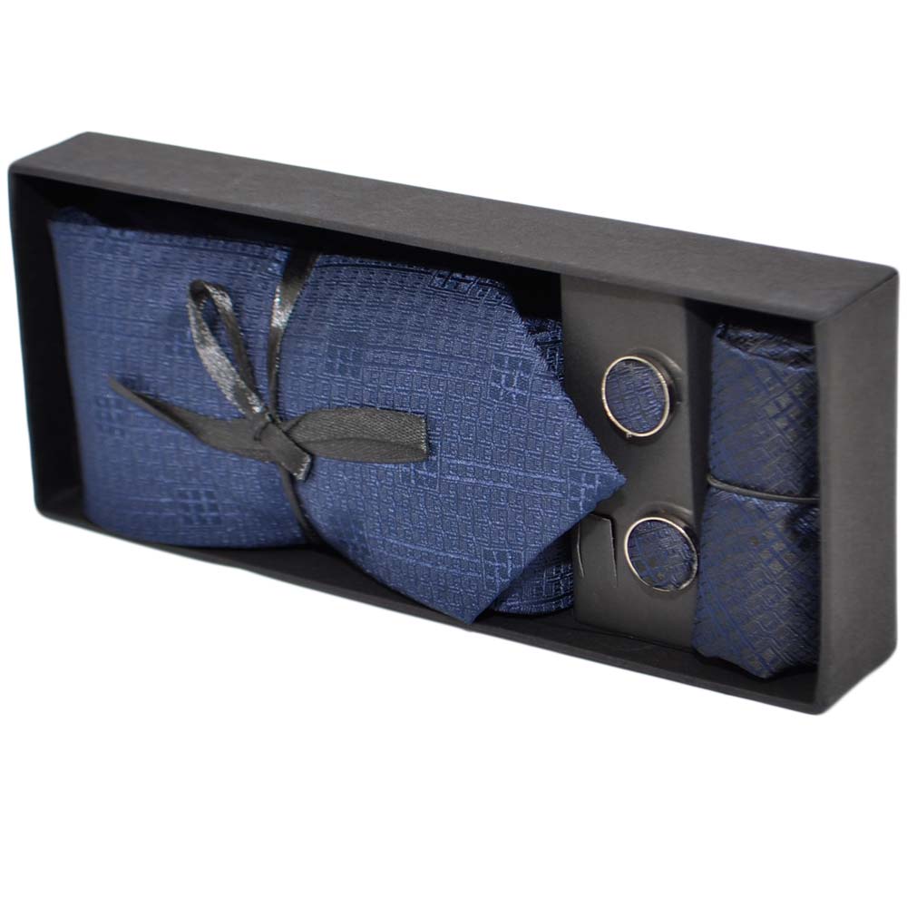 Set cravatta pochette e gemelli in cotone blu con dettagli tono su tono confezione regalo per professionisti .